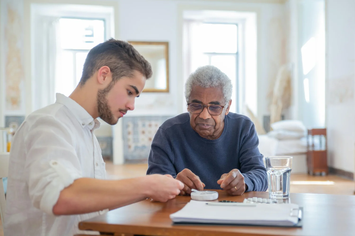A caregiver offering one-on-one support to an older adult